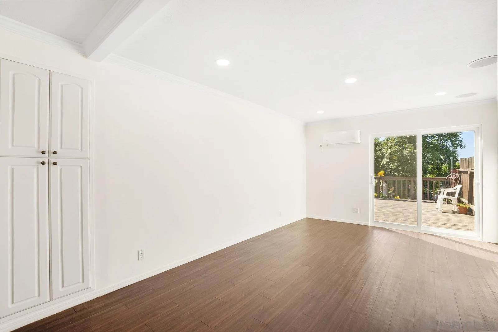 8545 Gardena Road Lakeside, CA 92040 - Photo 21 of 67 an empty room with wooden floor and windows