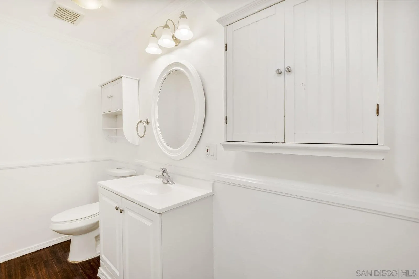 8545 Gardena Road Lakeside, CA 92040 - Photo 31 of 67 a bathroom with a sink a toilet and a mirror