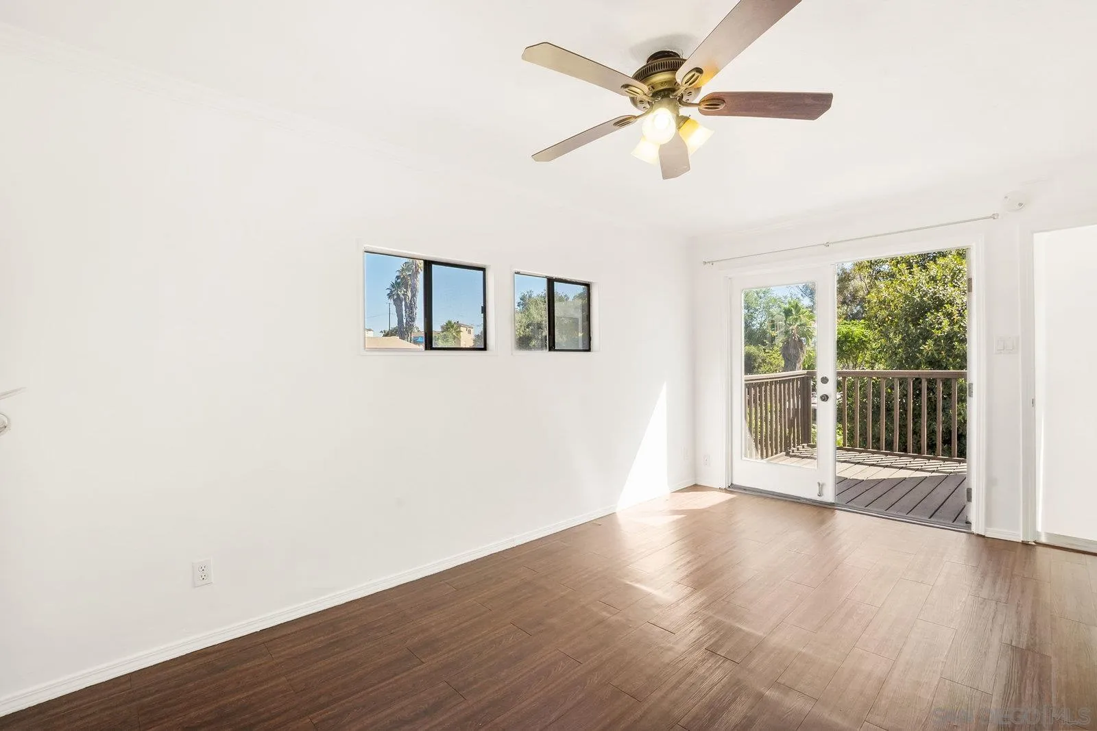 8545 Gardena Road Lakeside, CA 92040 - Photo 39 of 67 a view of an empty room with wooden floor and a window