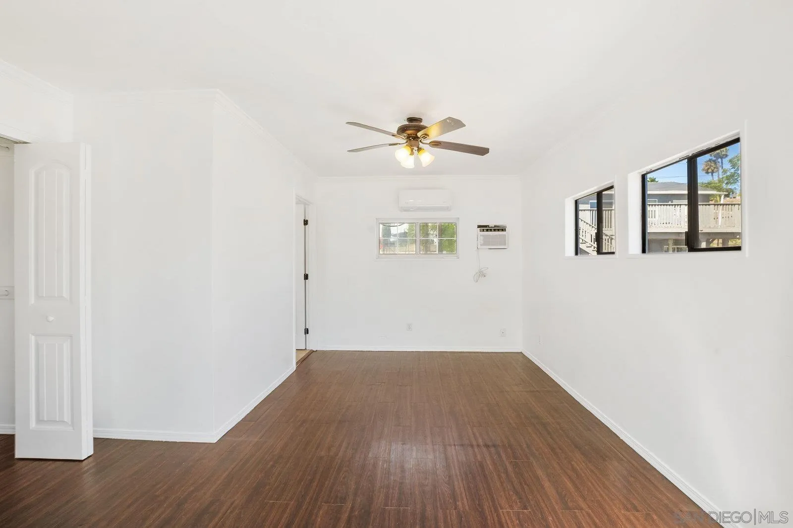 8545 Gardena Road Lakeside, CA 92040 - Photo 40 of 67 a view of a room with wooden floor and a ceiling fan