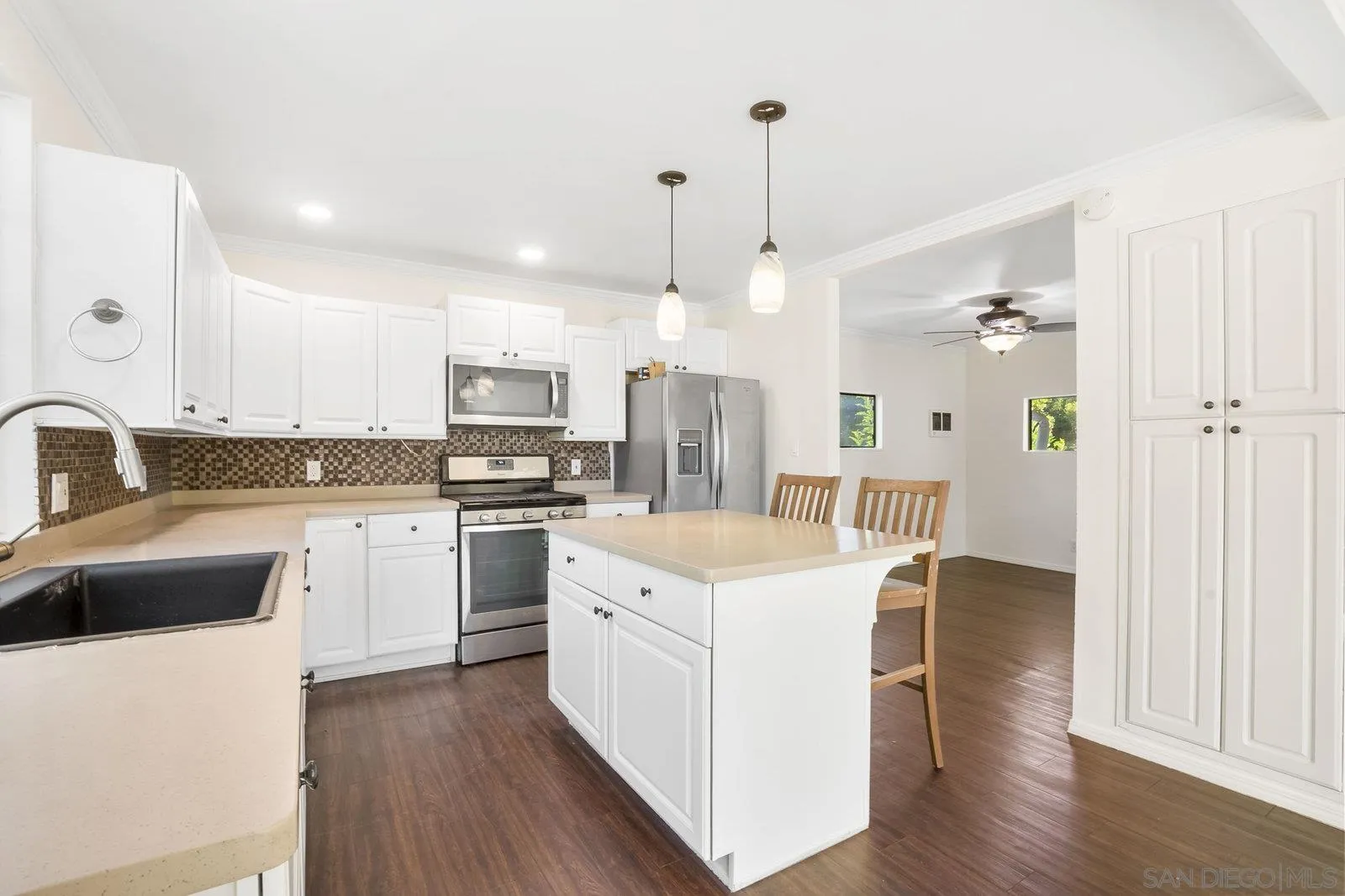 8545 Gardena Road Lakeside, CA 92040 - Photo 5 of 67 a kitchen with a sink stove and refrigerator