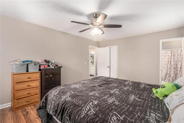 a bedroom with a bed and a dresser