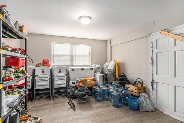 a bed room with furniture and a window