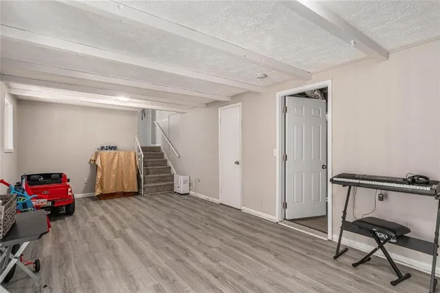 a bedroom with furniture and a window