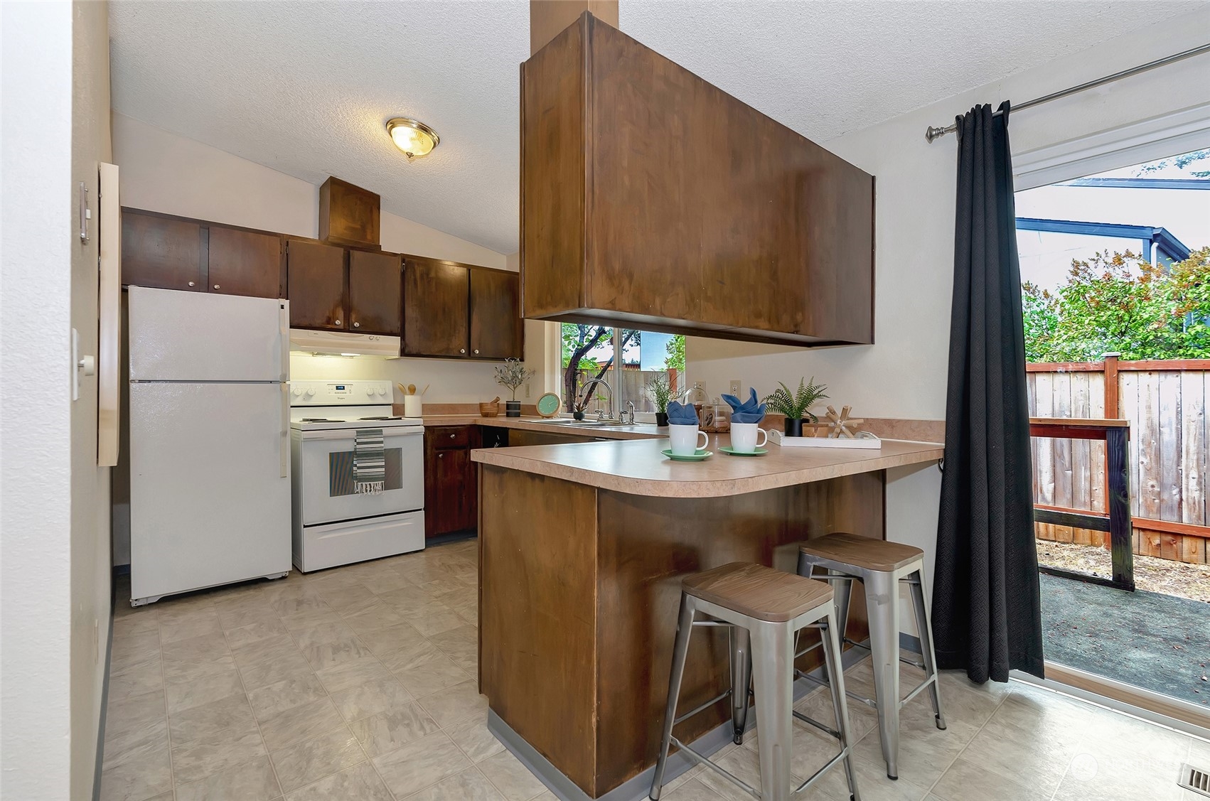 3006 Morrison Road West University Place, WA 98466 - Photo 12 of 32 a kitchen with a sink cabinets and window