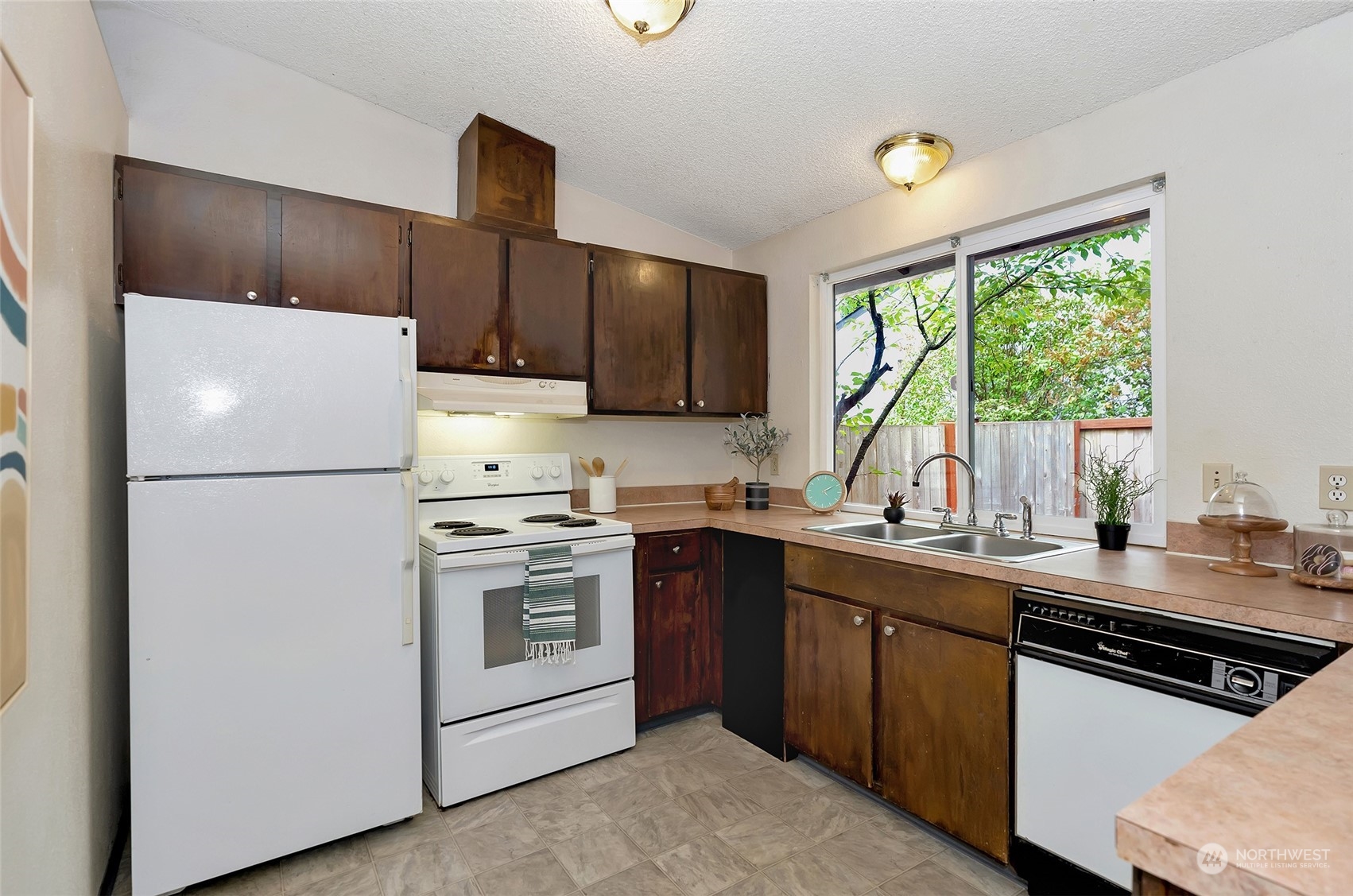 3006 Morrison Road West University Place, WA 98466 - Photo 13 of 32 a kitchen with a sink a stove and refrigerator