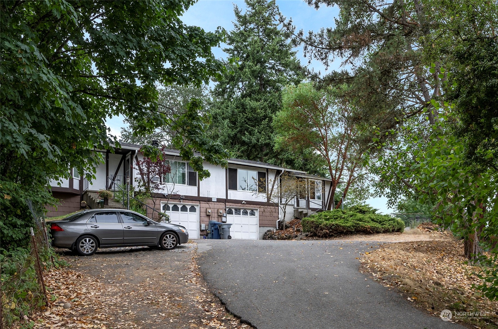3006 Morrison Road West University Place, WA 98466 - Photo 2 of 32 a car parked in front of a house
