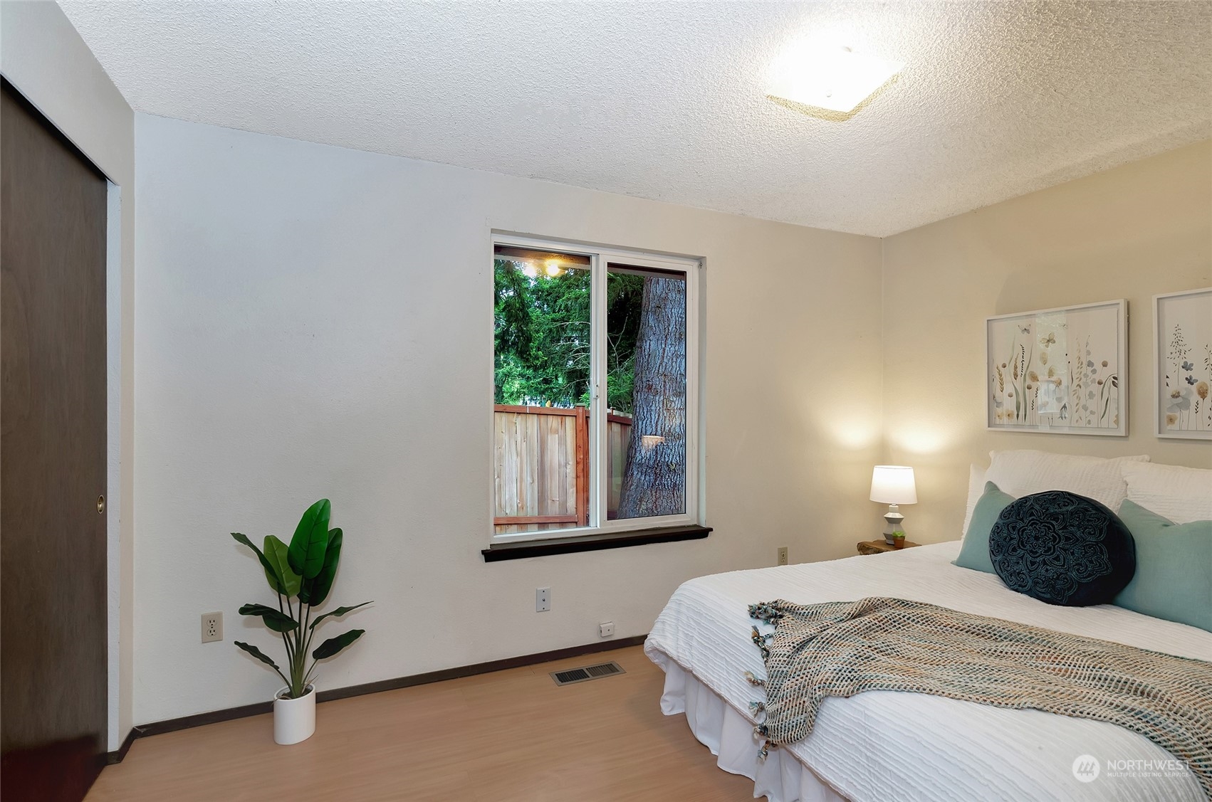 3006 Morrison Road West University Place, WA 98466 - Photo 21 of 32 a bedroom with a bed and glass windows