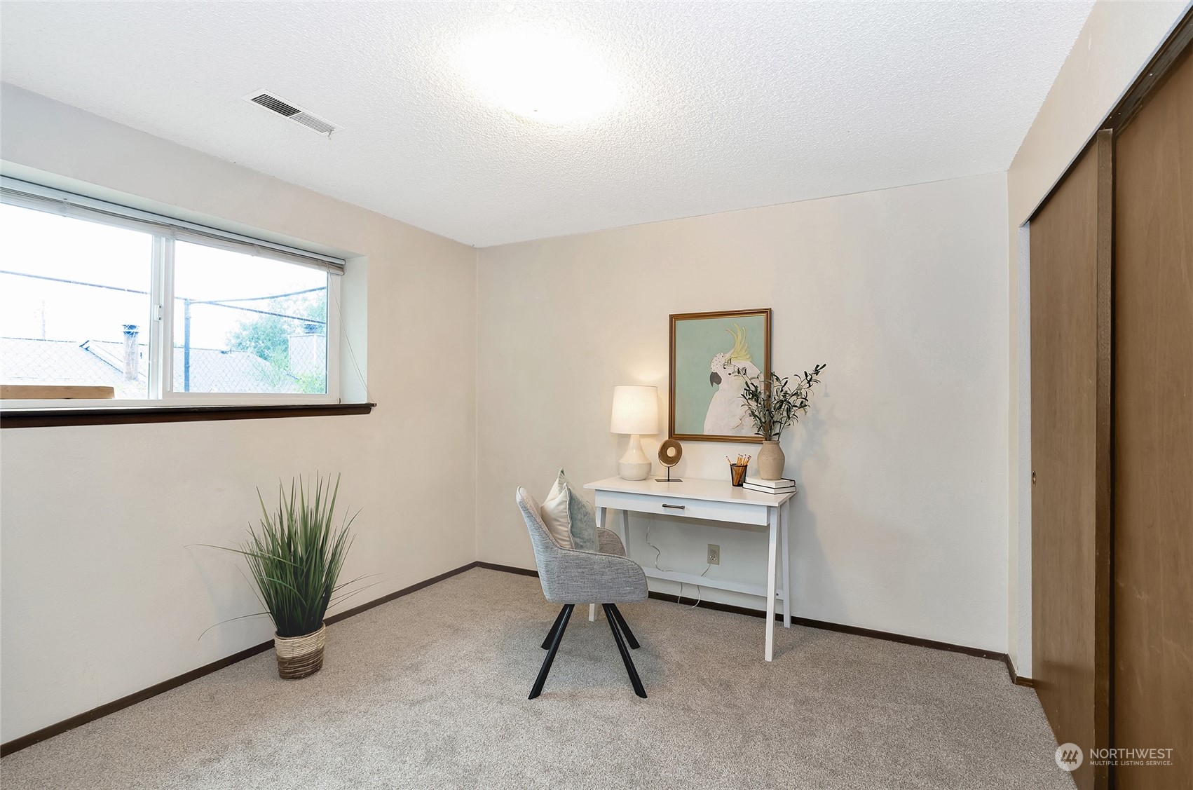 3006 Morrison Road West University Place, WA 98466 - Photo 22 of 32 a view of a workspace with furniture and a window