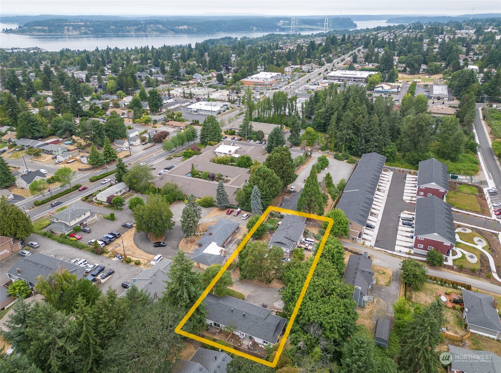 3006 Morrison Road West University Place, WA 98466 - Photo 32 of 32 an aerial view of residential houses with outdoor space and parking