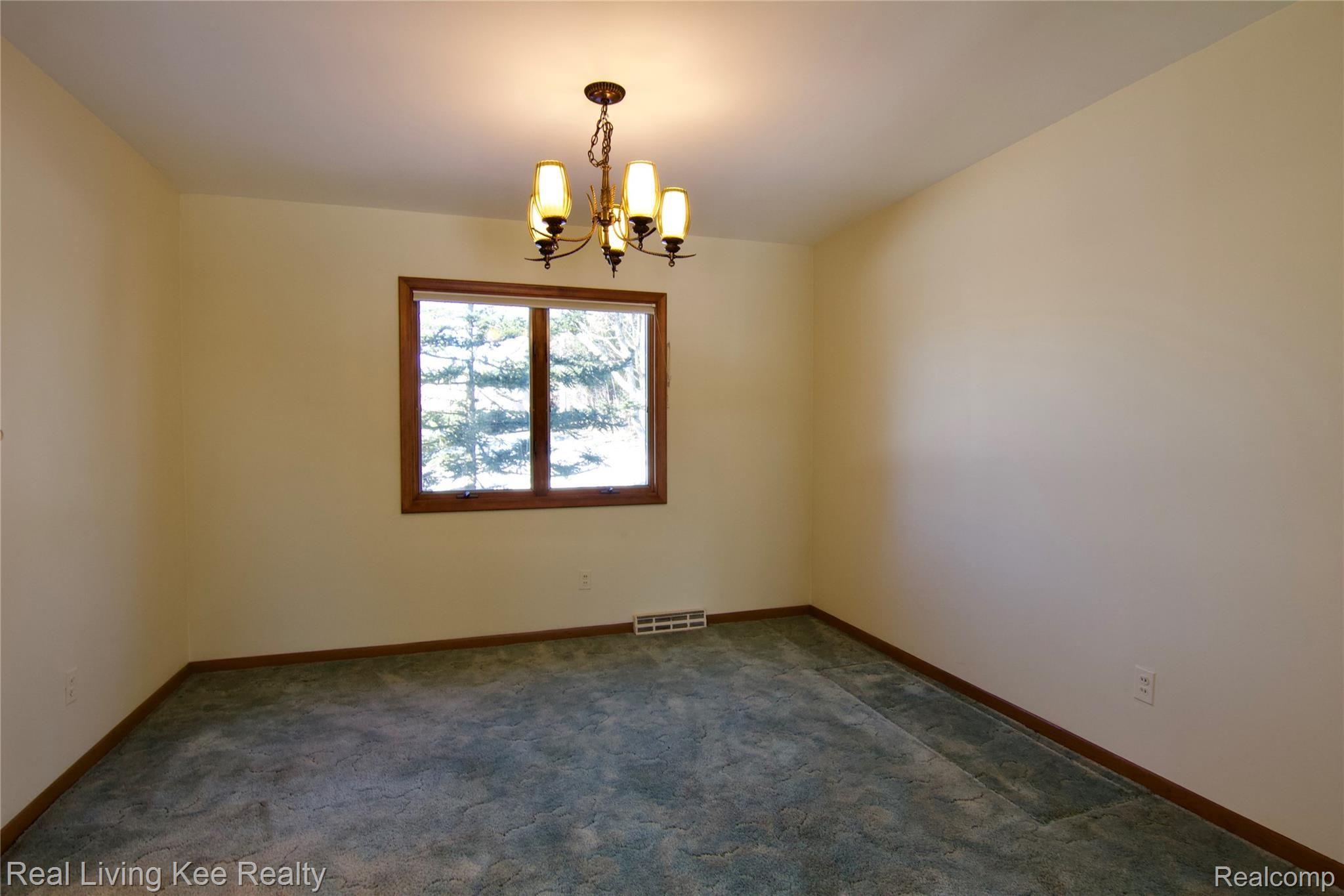 1859 Fair Oak Court Rochester, MI 48309 - Photo 8 of 36 Formal dining rm. also has hardwood flooring under the carpet.