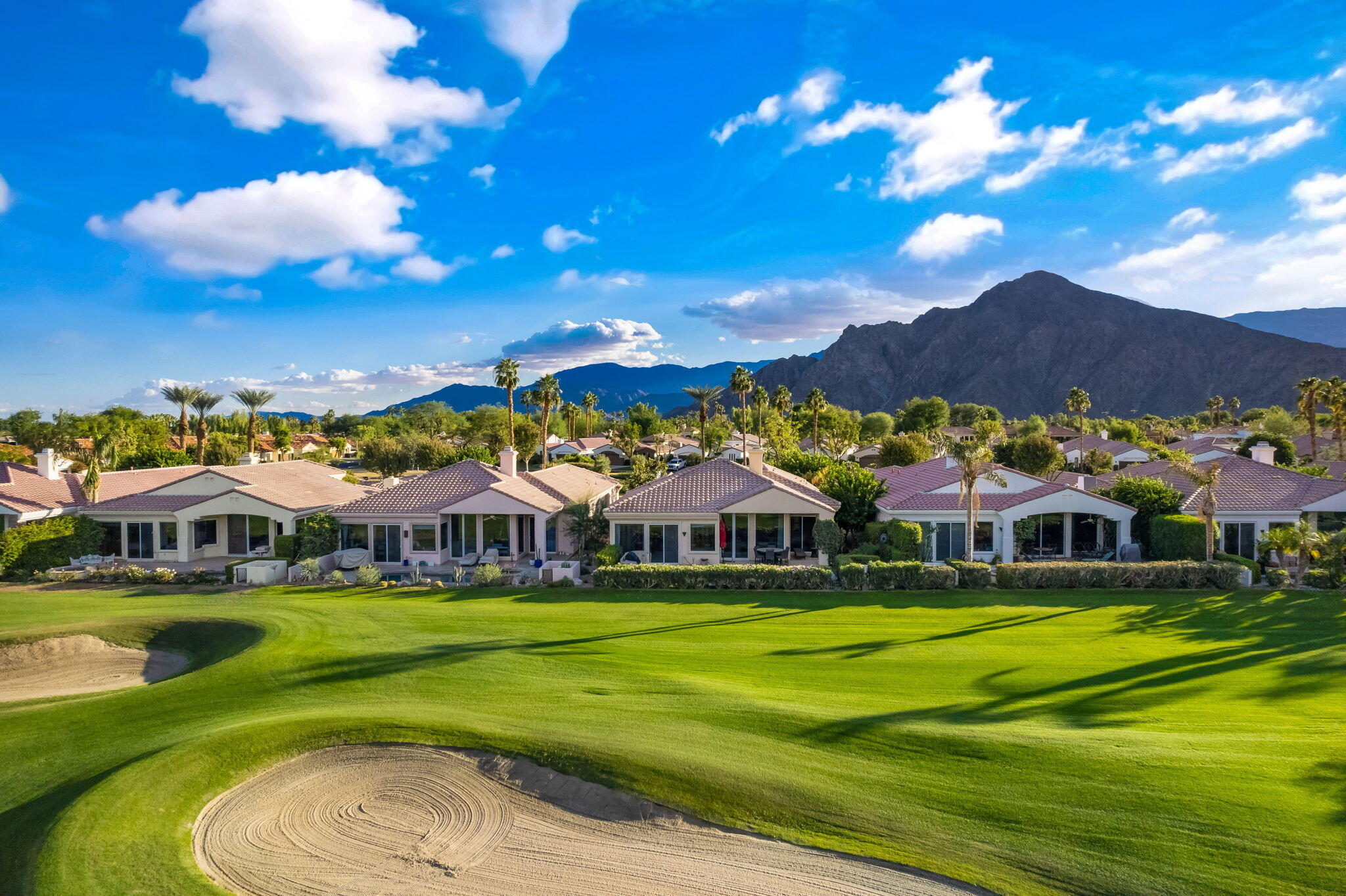 79440 Azahar La Quinta, CA 92253 - Photo 3 of 37 a view of an houses with swimming pool and outdoor space