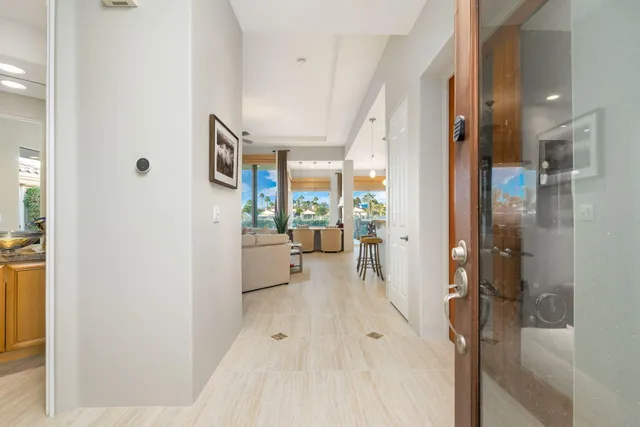 a view of a dining room with furniture and a potted plant