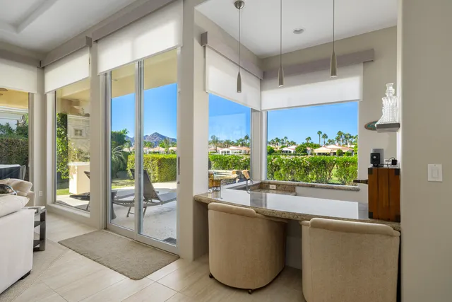 a bathroom with a bathtub sink and mirror