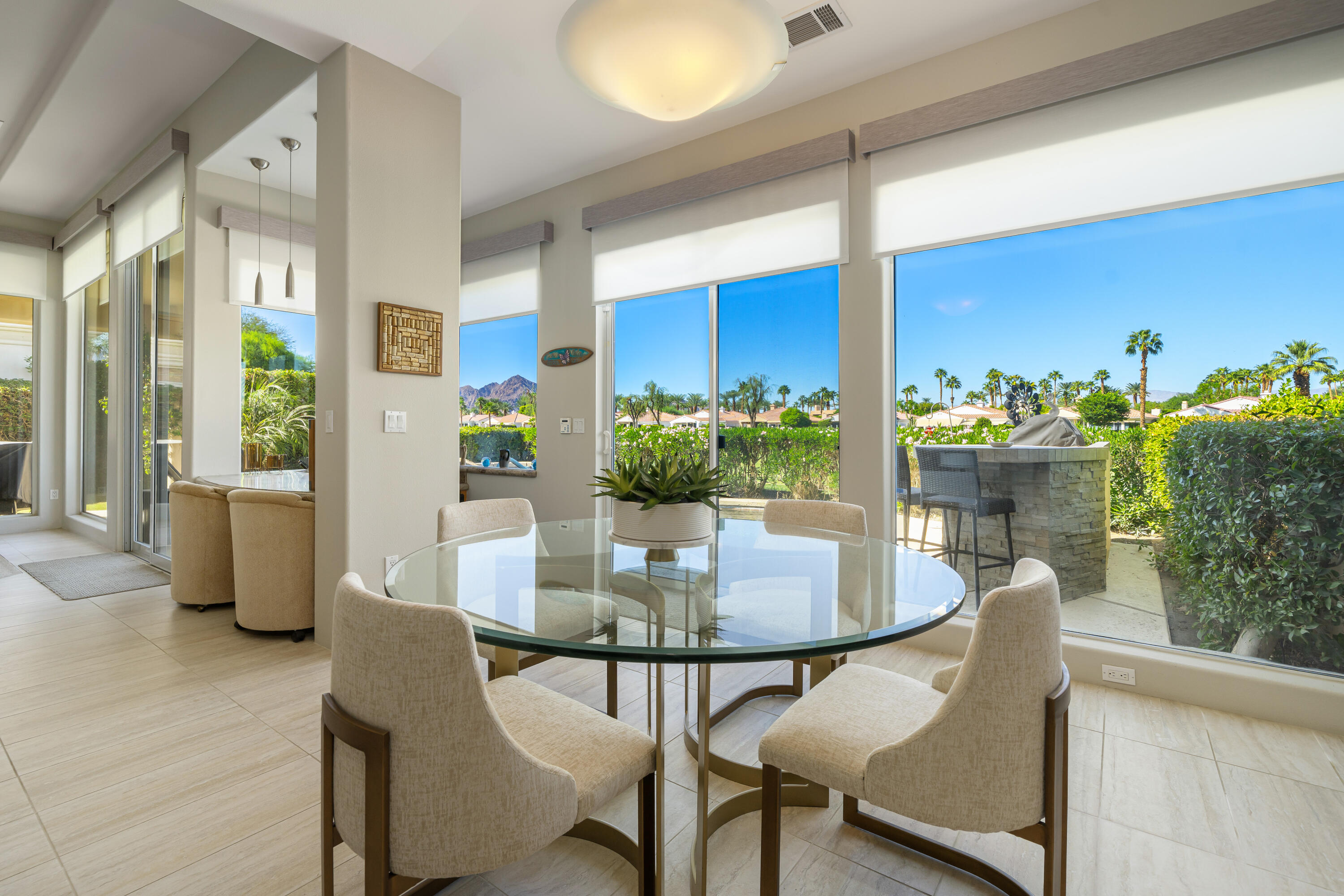 79440 Azahar La Quinta, CA 92253 - Photo 9 of 37 a view of a dining room with furniture and a potted plant