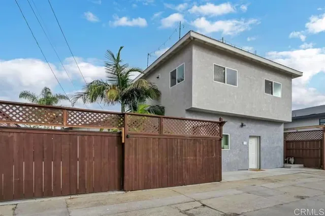 a view of a porch with wooden fence