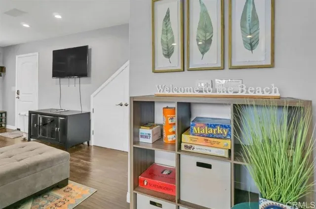 a bedroom with furniture and a flat screen tv
