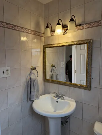 a bathroom with a sink and mirror