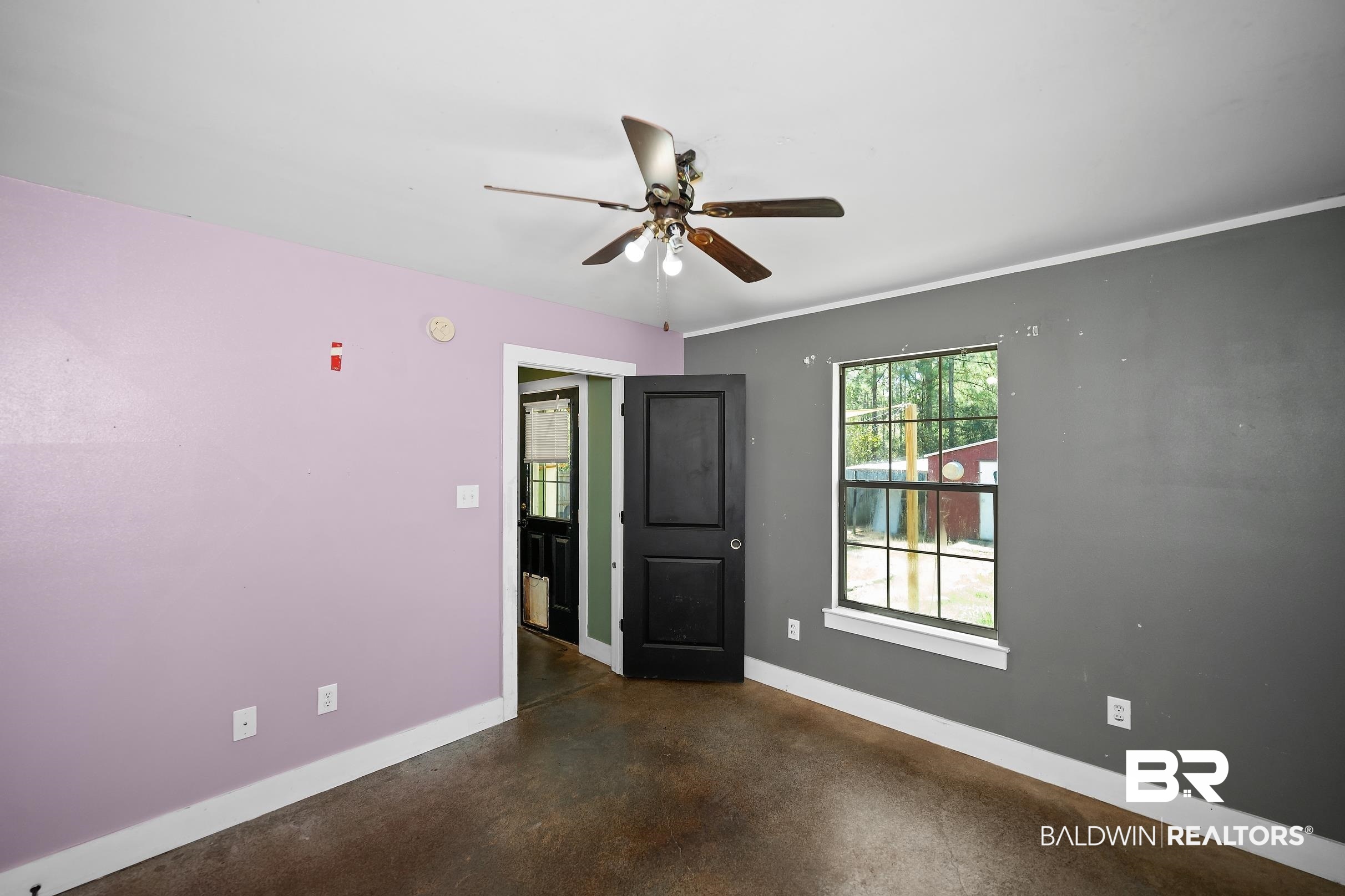 2000 Maria Lane Lillian, AL 36549 - Photo 13 of 35 Unfurnished room with finished concrete floors and ceiling fan
