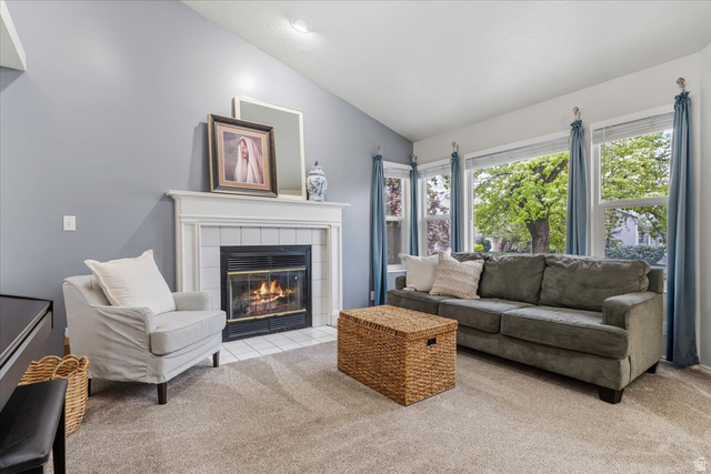 7975 Showcase Lane Sandy, UT 84094 - Photo 4 of 29 Living room with vaulted ceiling and large windows to front