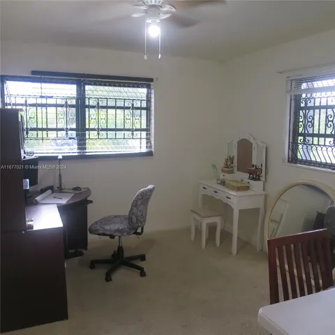 a work room with furniture and windows
