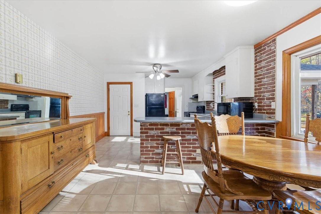 15357 Old Forty Road Waverly, VA 23890 - Photo 12 of 42 a living room with furniture a flat screen tv and kitchen view