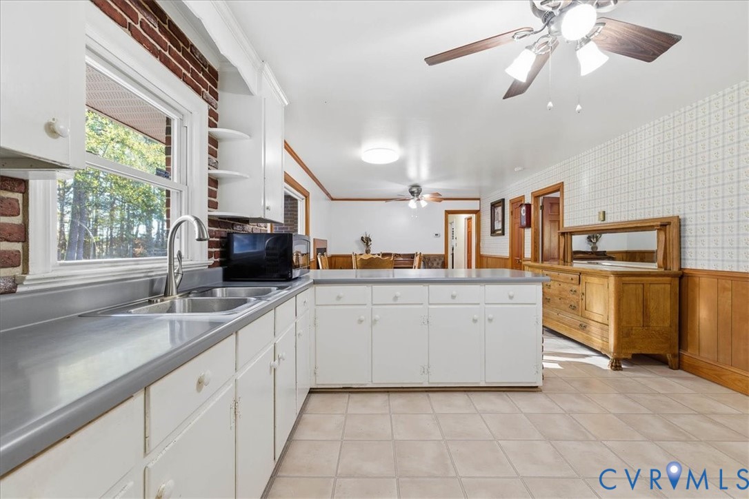 15357 Old Forty Road Waverly, VA 23890 - Photo 16 of 42 a kitchen with cabinets and window