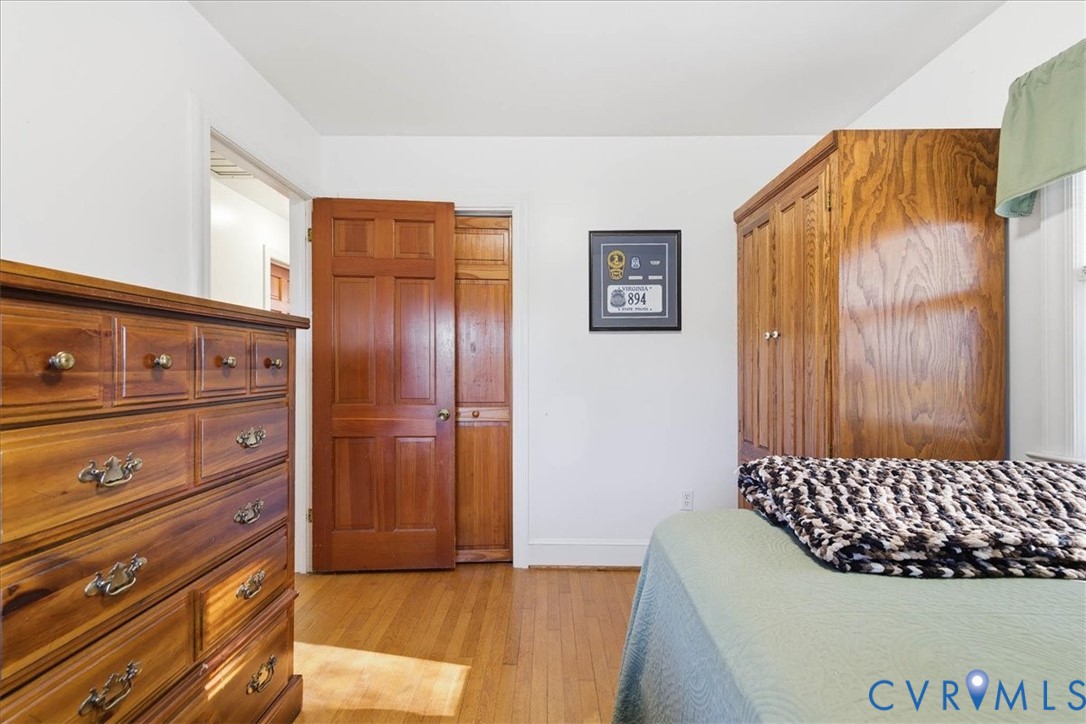 15357 Old Forty Road Waverly, VA 23890 - Photo 19 of 42 a bedroom with a bed and a dresser