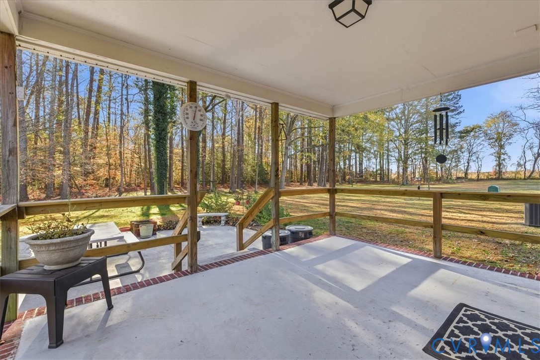 15357 Old Forty Road Waverly, VA 23890 - Photo 25 of 42 a living room with furniture and large windows