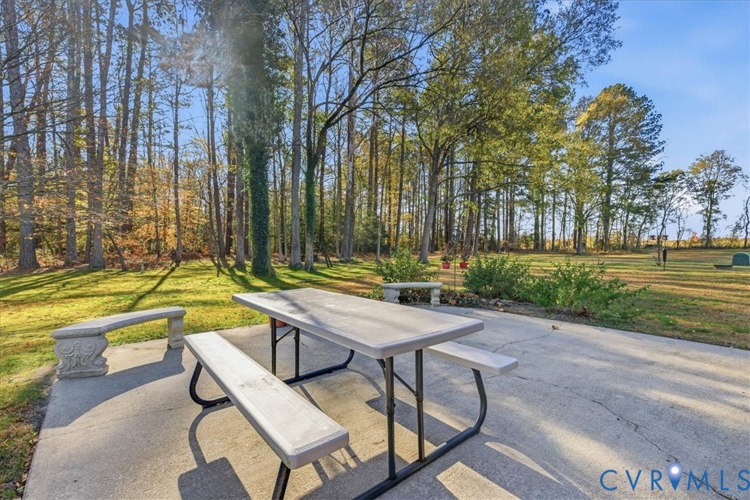 15357 Old Forty Road Waverly, VA 23890 - Photo 26 of 42 a view of swimming pool with chairs and trees