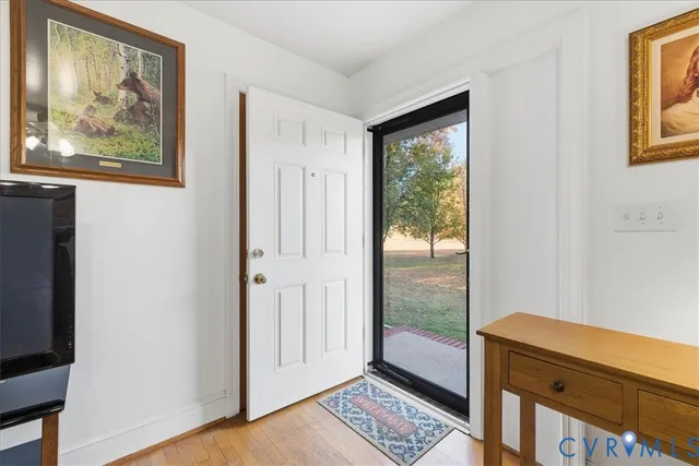 a view of room with window and wooden floor