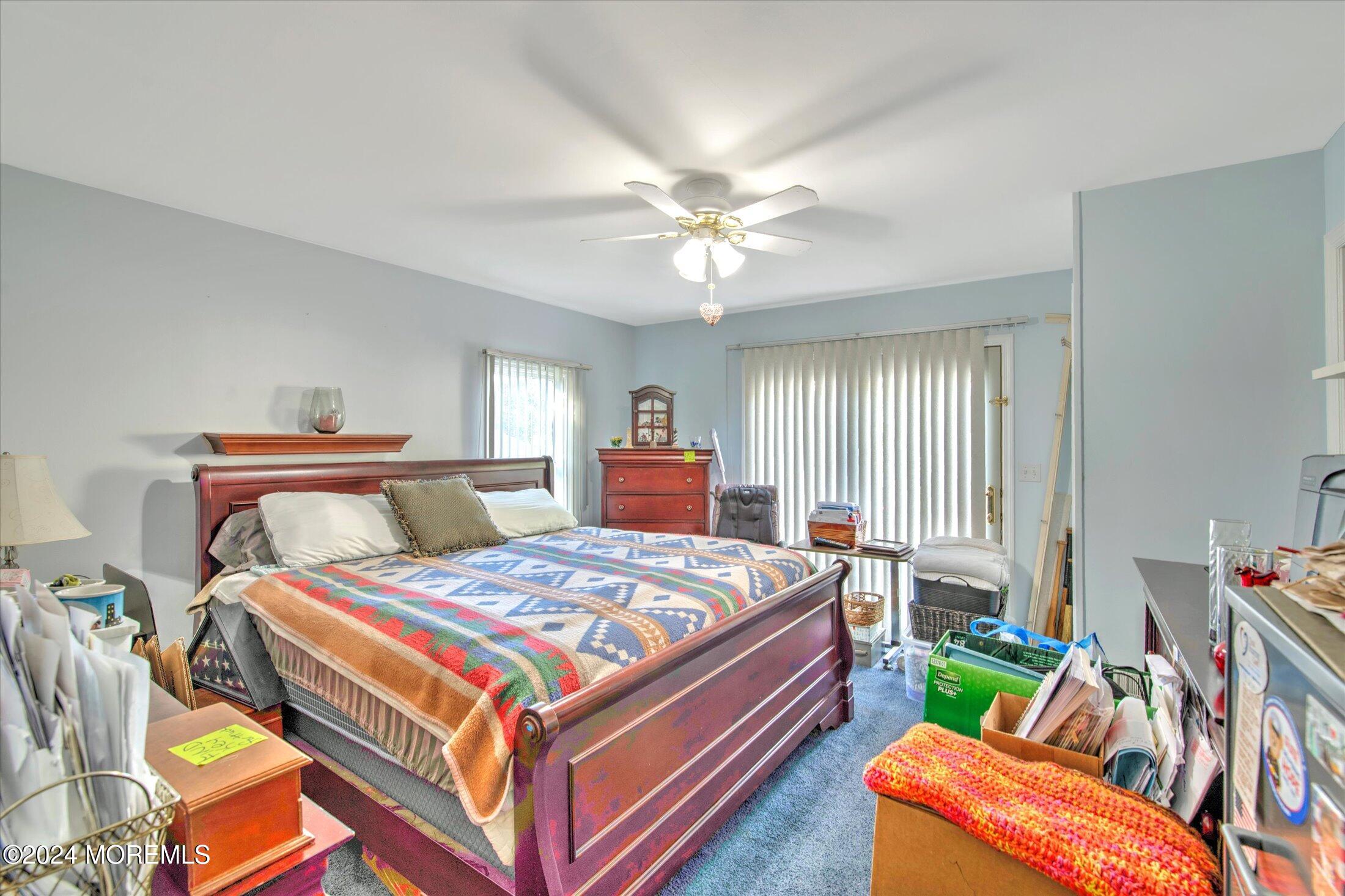17 Club Place Freehold, NJ 07728 - Photo 11 of 27 a bedroom with a bed and a chair