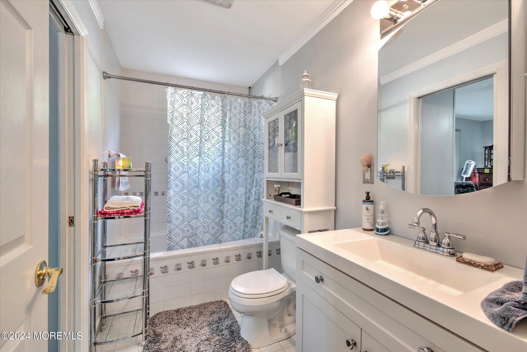 17 Club Place Freehold, NJ 07728 - Photo 12 of 27 a bathroom with a granite countertop sink toilet and shower