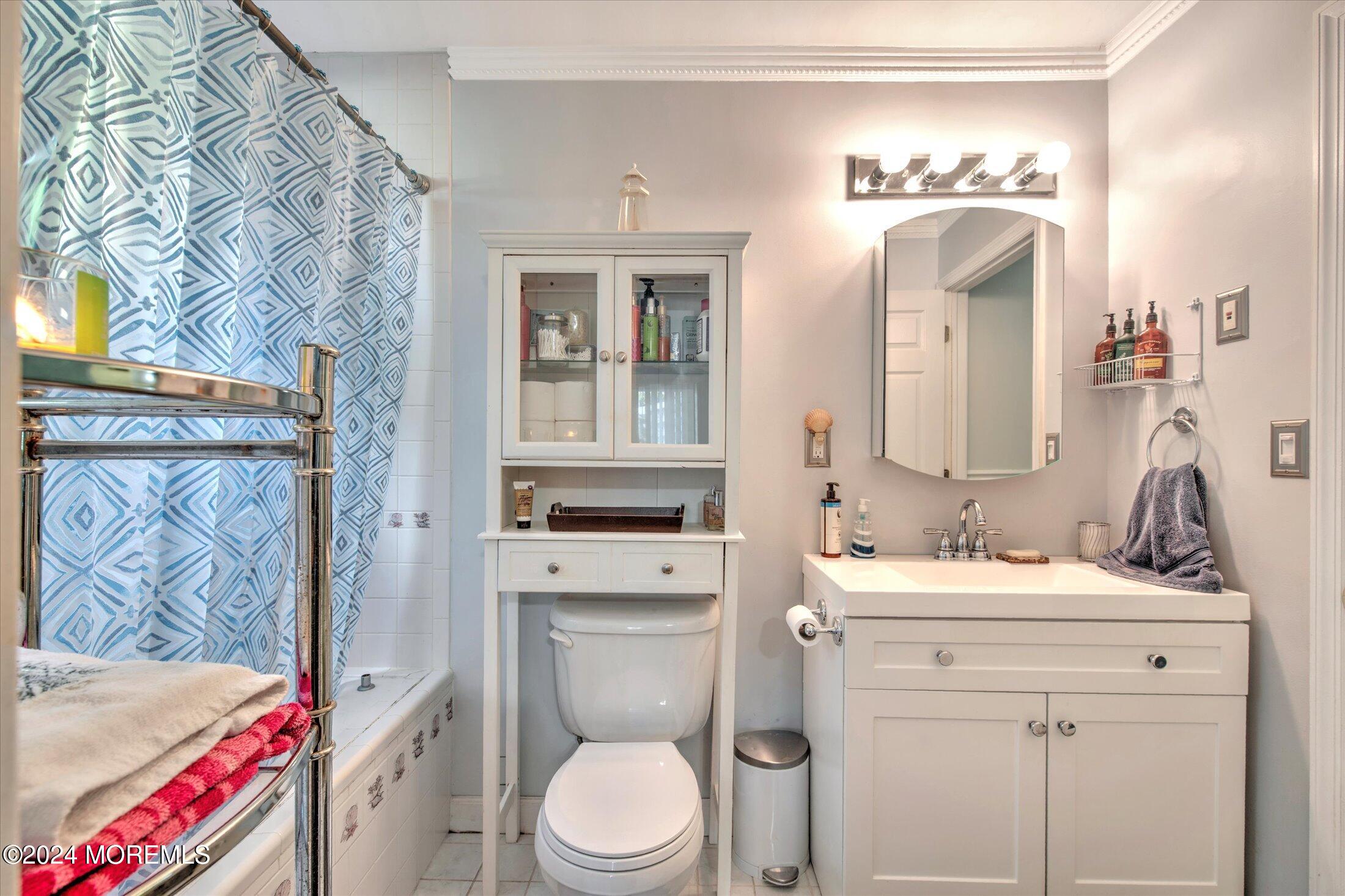 17 Club Place Freehold, NJ 07728 - Photo 13 of 27 a bathroom with a toilet sink and mirror
