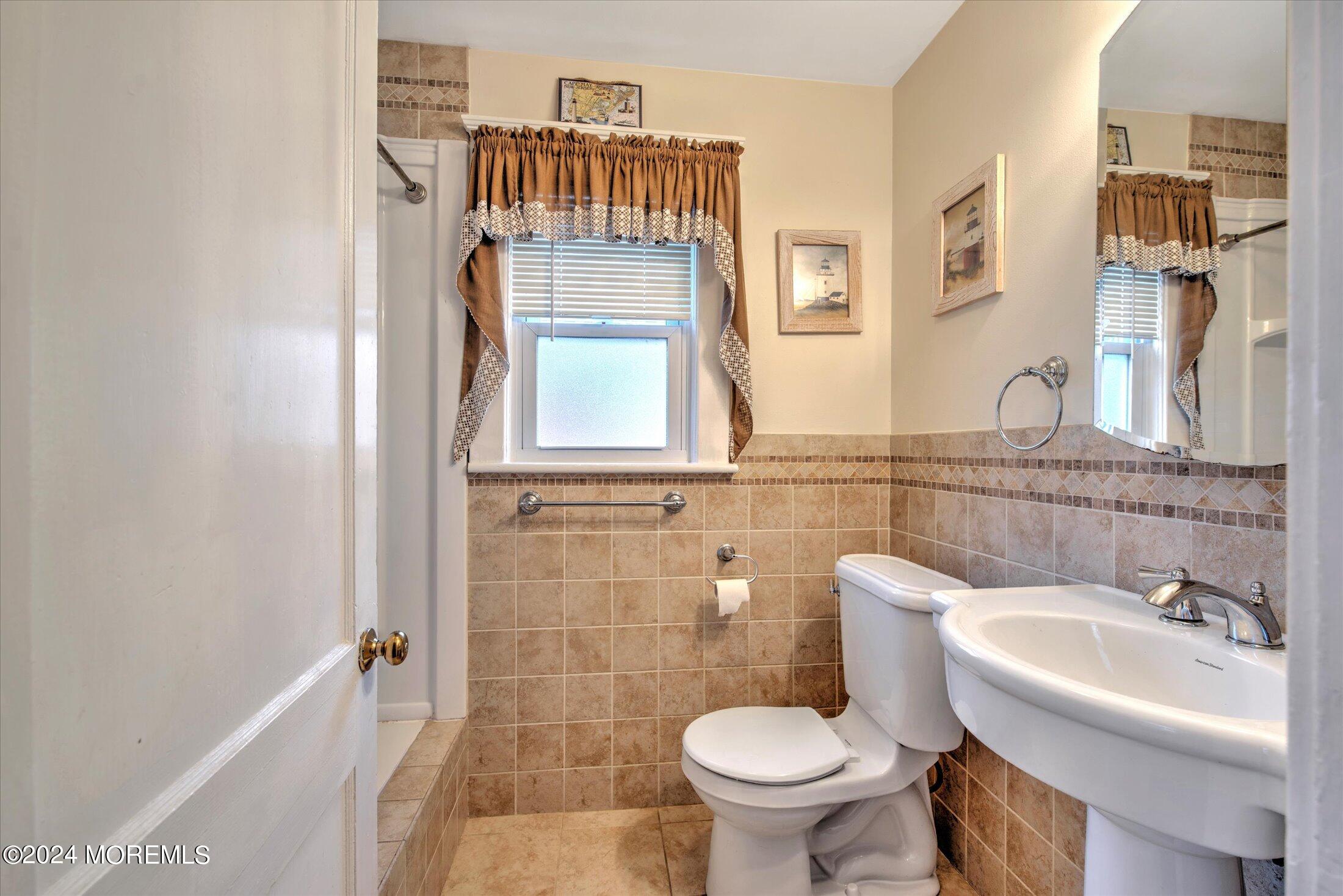 17 Club Place Freehold, NJ 07728 - Photo 16 of 27 a bathroom with a sink toilet and shower