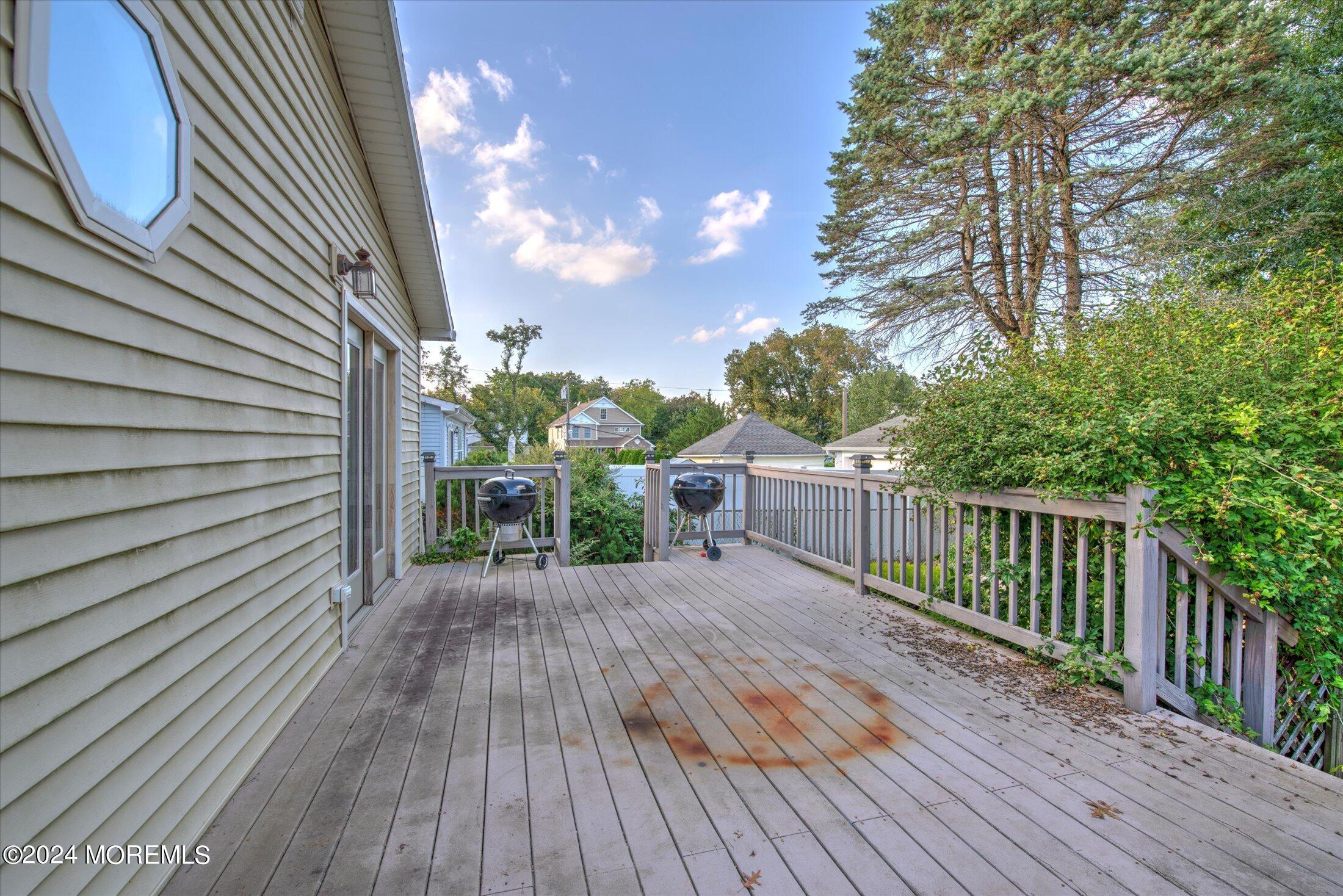 17 Club Place Freehold, NJ 07728 - Photo 20 of 27 a view of backyard with a deck and wooden floor