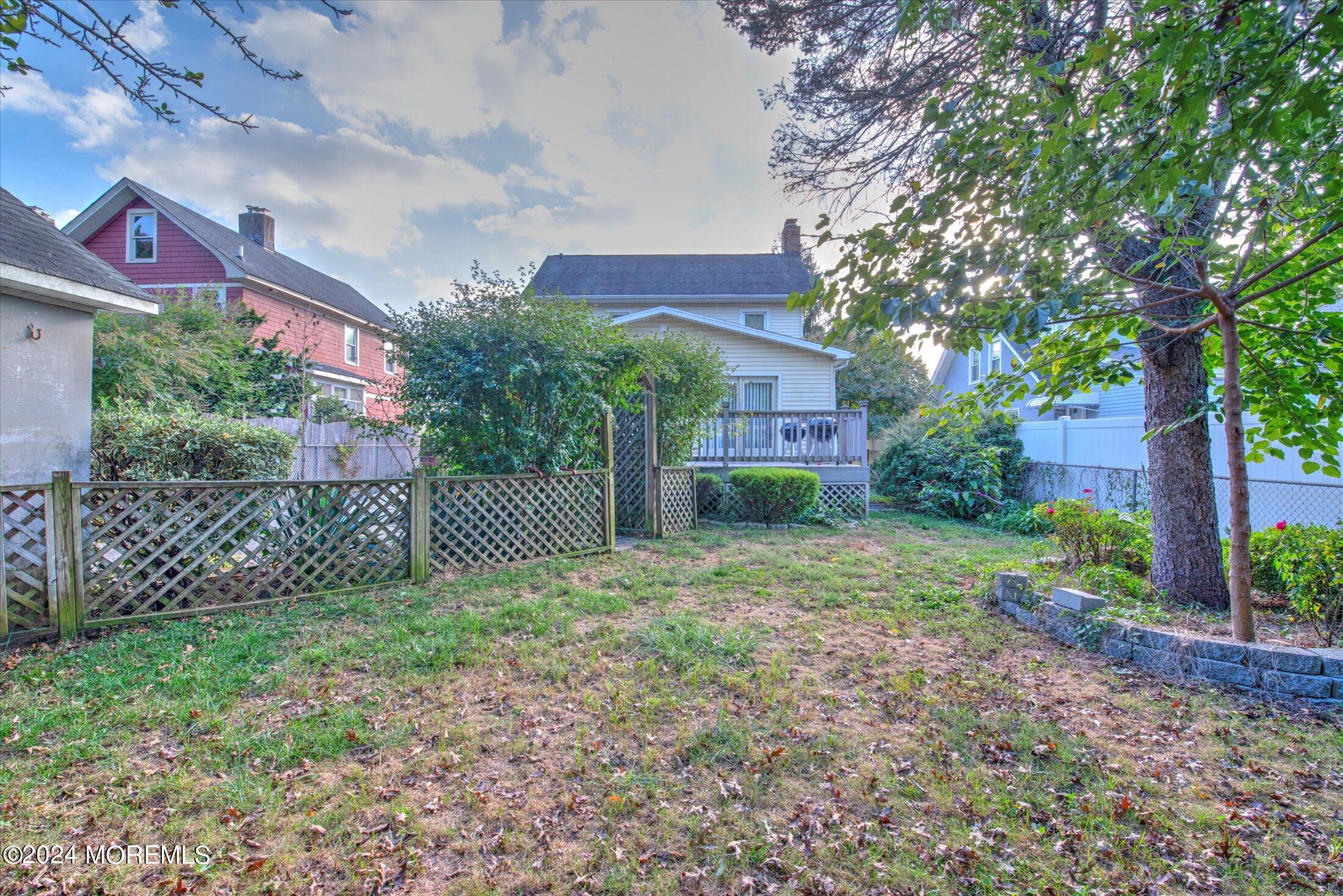 17 Club Place Freehold, NJ 07728 - Photo 24 of 27 a view of a house with a yard and hanging chair