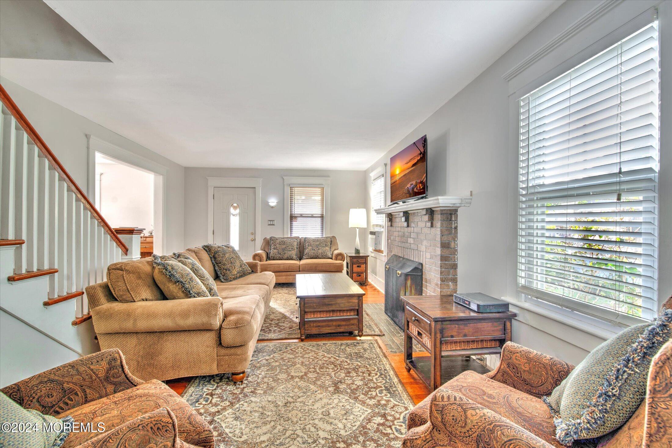 17 Club Place Freehold, NJ 07728 - Photo 4 of 27 a living room with furniture fireplace and a window