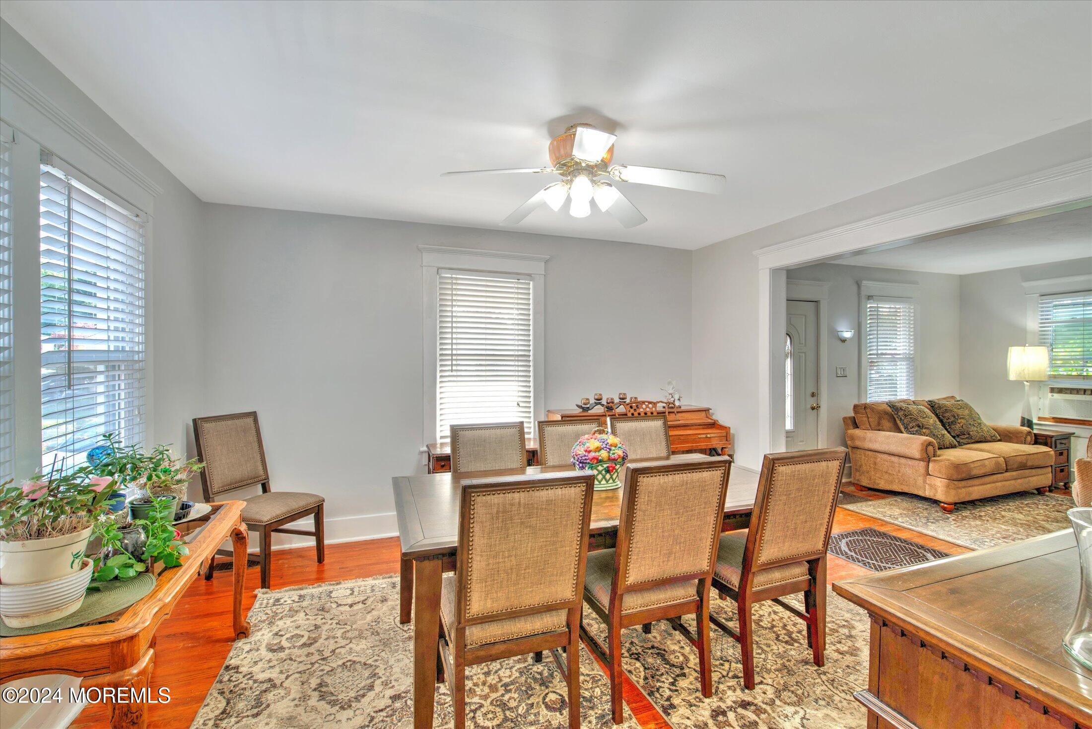 17 Club Place Freehold, NJ 07728 - Photo 6 of 27 a view of a dining room with furniture and a potted plant