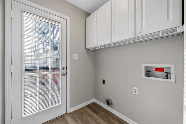 a view of a kitchen that has a sink and cabinets