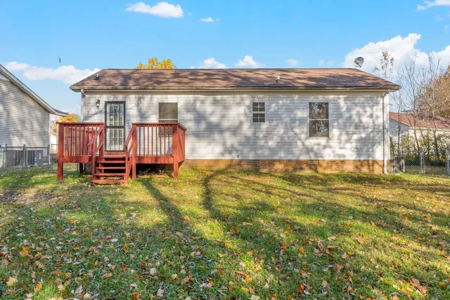 a view of a big yard with large trees