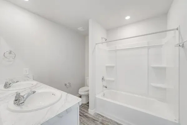 a bathroom with a bathtub and a sink