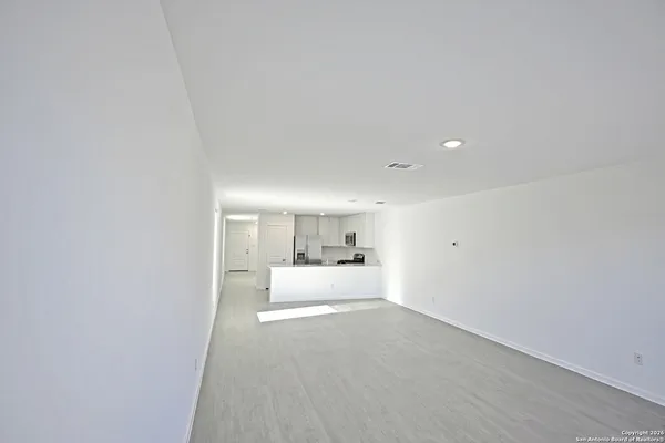 a view of a kitchen with a sink and cabinets