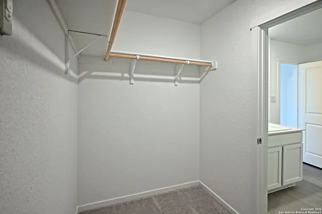 a view of an empty walk in closet