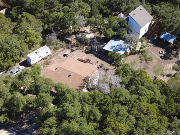an aerial view of multiple house with outdoor space