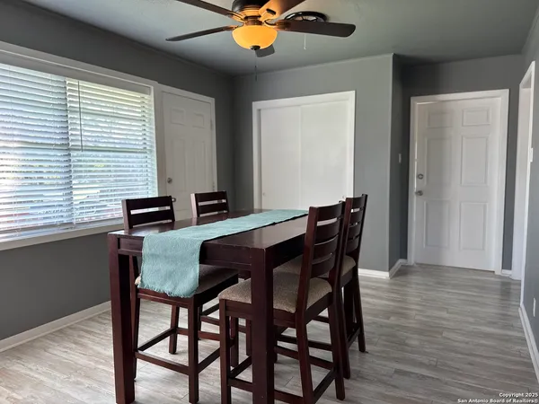 a dining room with furniture and window