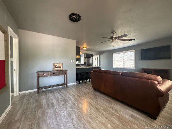 a living room with furniture and a window