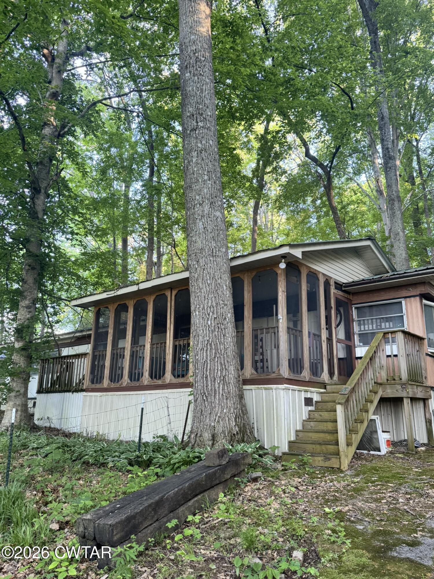75 Elkins Road Decaturville, TN 38329 - Photo 1 of 8 front view of a house with a yard