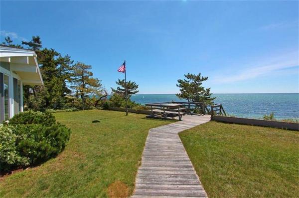 89 Shore Road Harwich, MA 02671 - Photo 18 of 20 a swimming pool with outdoor seating and garden
