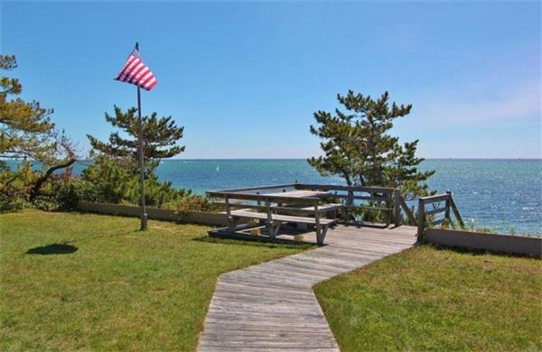 89 Shore Road Harwich, MA 02671 - Photo 3 of 20 a swimming pool with barbeque oven table and chairs